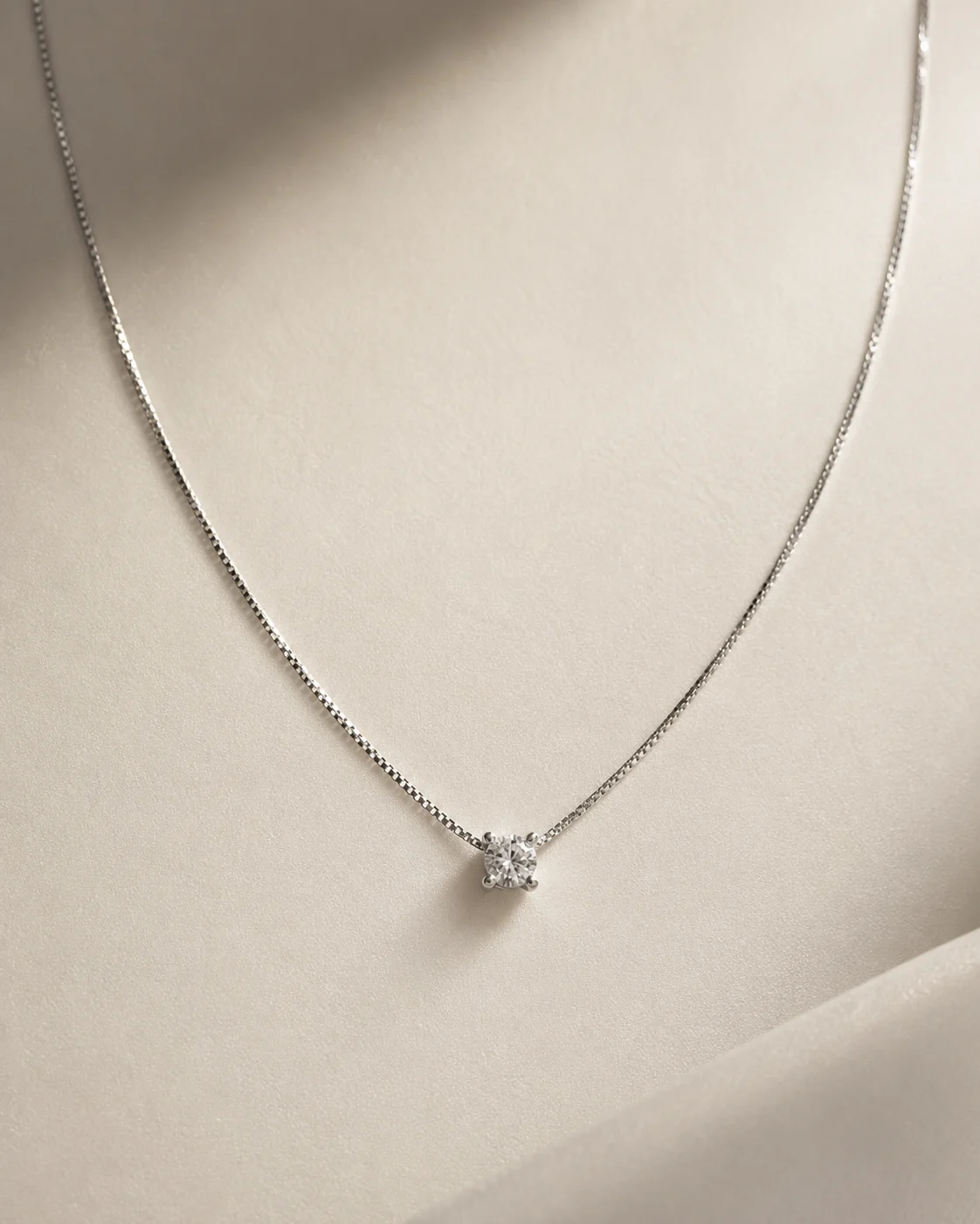 Punto luce in oro bianco 18 kt e diamante